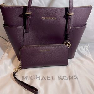 Beautiful plum colored coated leather MK shoulder bag with matching wallet.